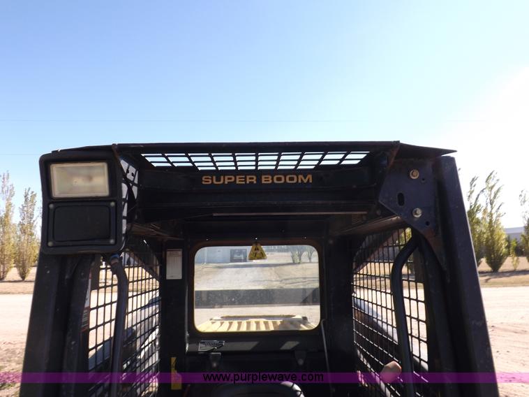 image for item H9012 1999 New Holland LX985 skid steer