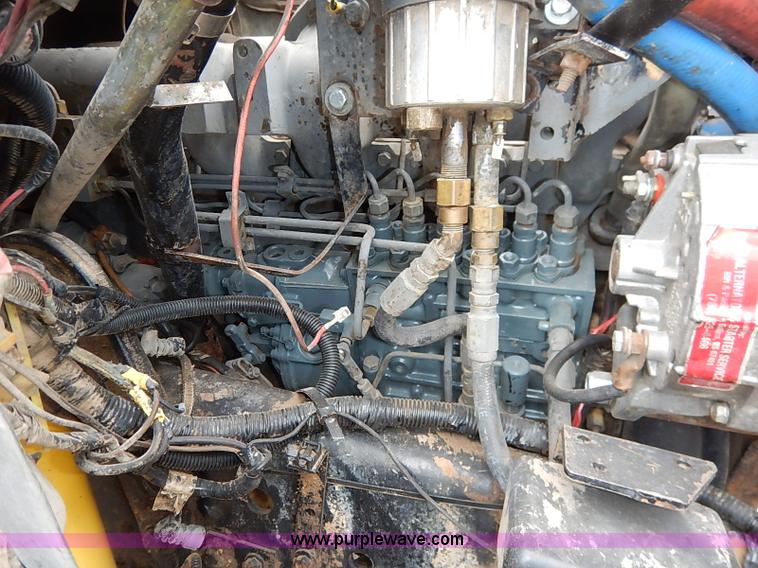 image for item I5297 1989 Ford F700 Custom Cab flatbed truck