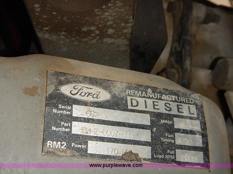 image for item I5297 1989 Ford F700 Custom Cab flatbed truck