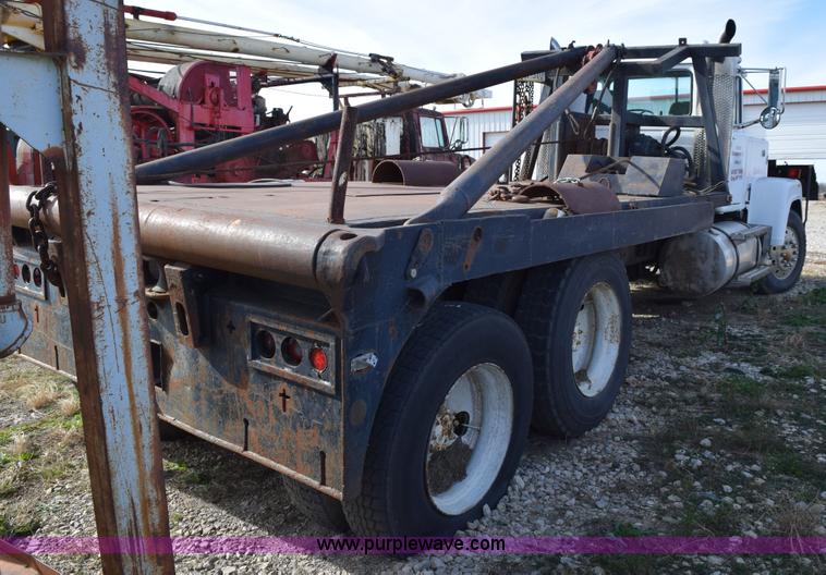 image for item I8662 1985 Mack RWS 722LST Super Liner flatbed truck