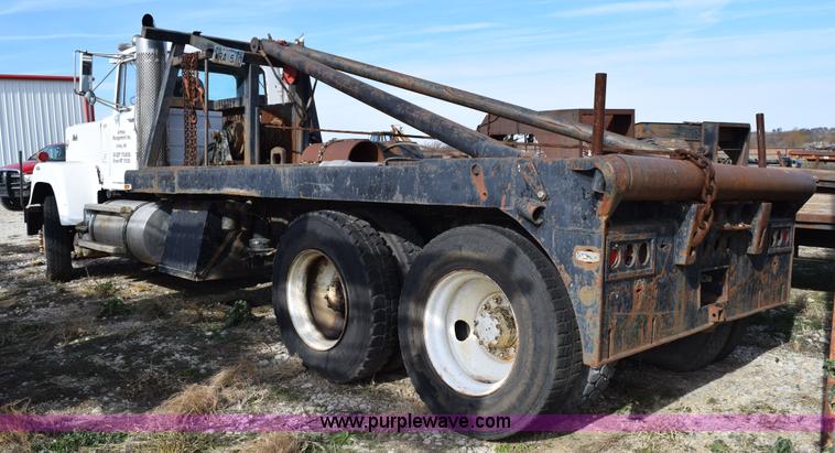 image for item I8662 1985 Mack RWS 722LST Super Liner flatbed truck