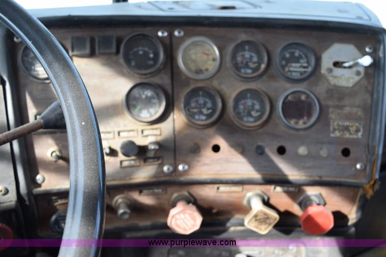 image for item I8662 1985 Mack RWS 722LST Super Liner flatbed truck