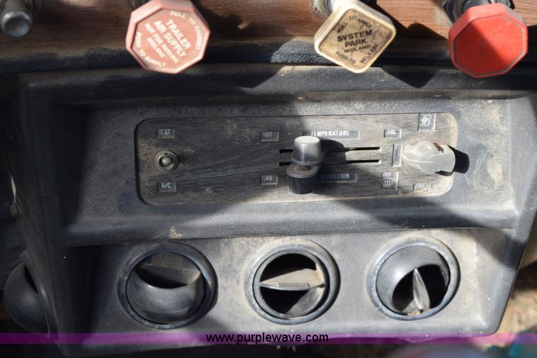 image for item I8662 1985 Mack RWS 722LST Super Liner flatbed truck