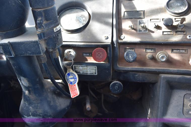 image for item I8662 1985 Mack RWS 722LST Super Liner flatbed truck