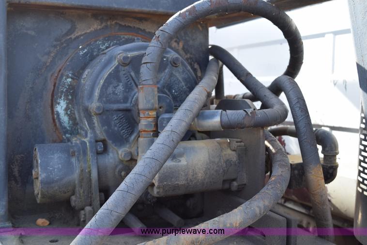 image for item I8662 1985 Mack RWS 722LST Super Liner flatbed truck