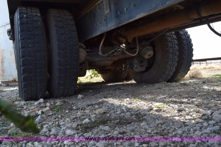 image for item I8662 1985 Mack RWS 722LST Super Liner flatbed truck