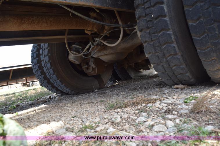 image for item I8662 1985 Mack RWS 722LST Super Liner flatbed truck