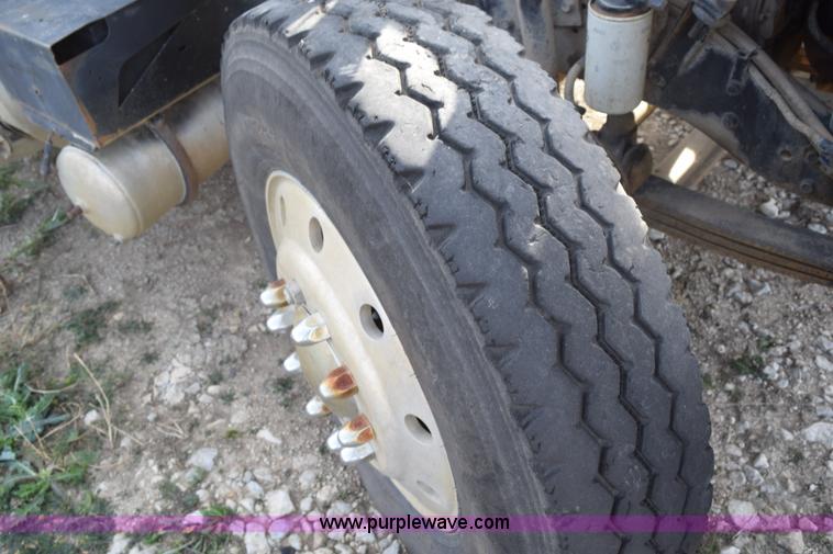 image for item I8662 1985 Mack RWS 722LST Super Liner flatbed truck