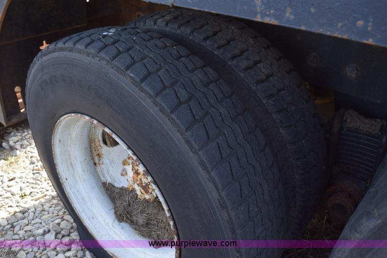 image for item I8662 1985 Mack RWS 722LST Super Liner flatbed truck