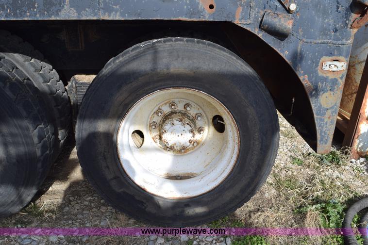 image for item I8662 1985 Mack RWS 722LST Super Liner flatbed truck