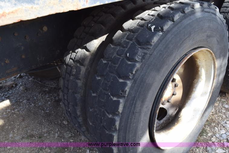 image for item I8662 1985 Mack RWS 722LST Super Liner flatbed truck