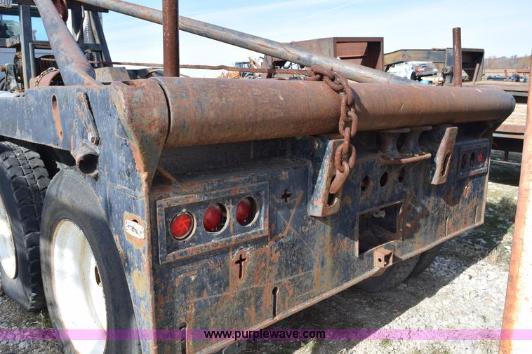 image for item I8662 1985 Mack RWS 722LST Super Liner flatbed truck