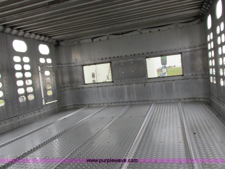 image for item I8890 1999 Wilson PSAL-303P aluminum livestock trailer