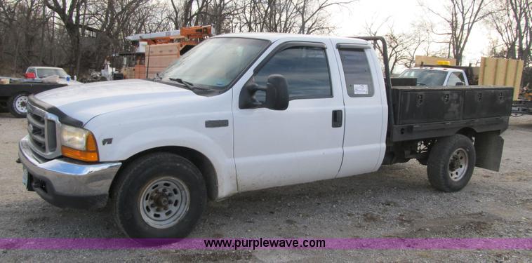 image for item F8896 2002 Ford F250 Super Duty XL flatbed pickup truck