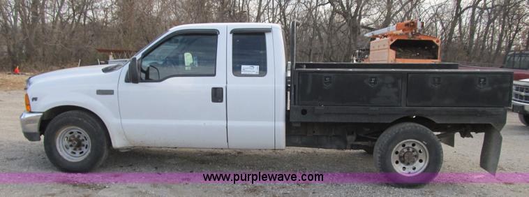 image for item F8896 2002 Ford F250 Super Duty XL flatbed pickup truck
