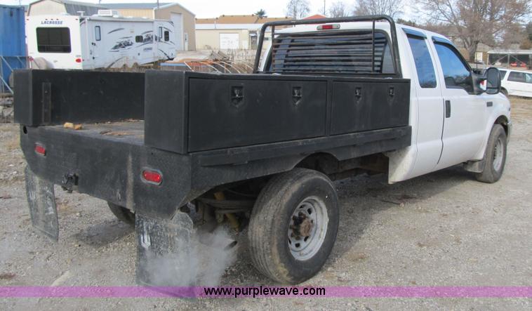 image for item F8896 2002 Ford F250 Super Duty XL flatbed pickup truck
