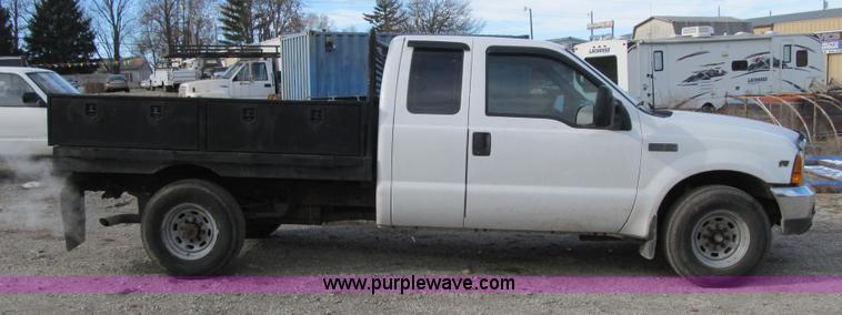 image for item F8896 2002 Ford F250 Super Duty XL flatbed pickup truck