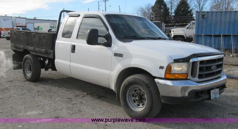 image for item F8896 2002 Ford F250 Super Duty XL flatbed pickup truck