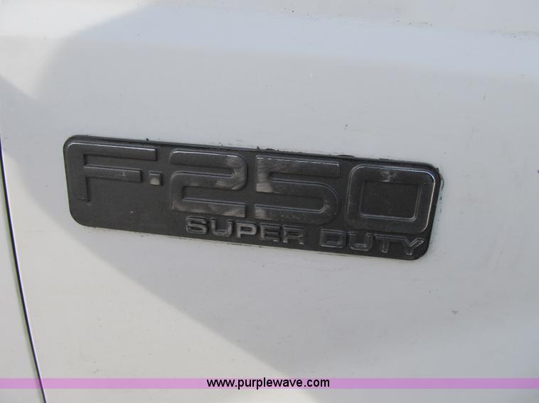 image for item F8896 2002 Ford F250 Super Duty XL flatbed pickup truck