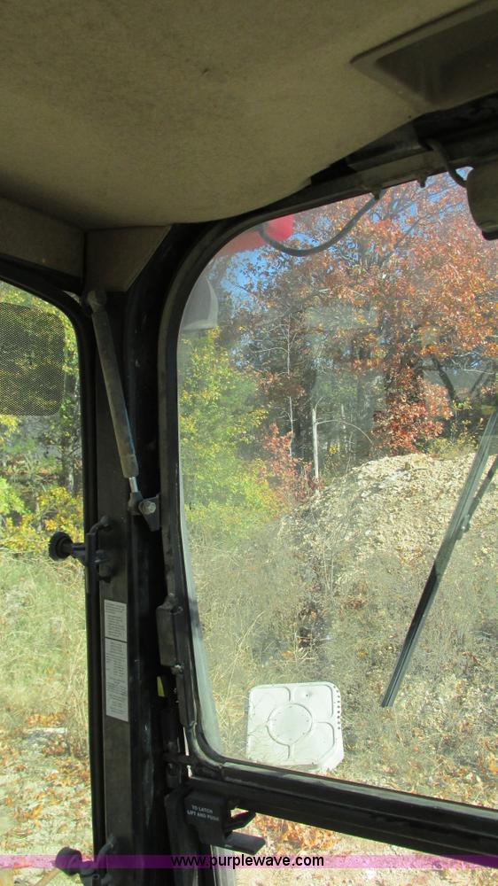 image for item I3182 1999 John Deere 310SE backhoe