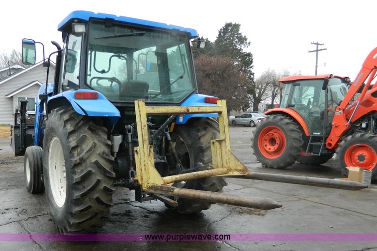 image for item H2306 2002 New Holland TL100 tractor