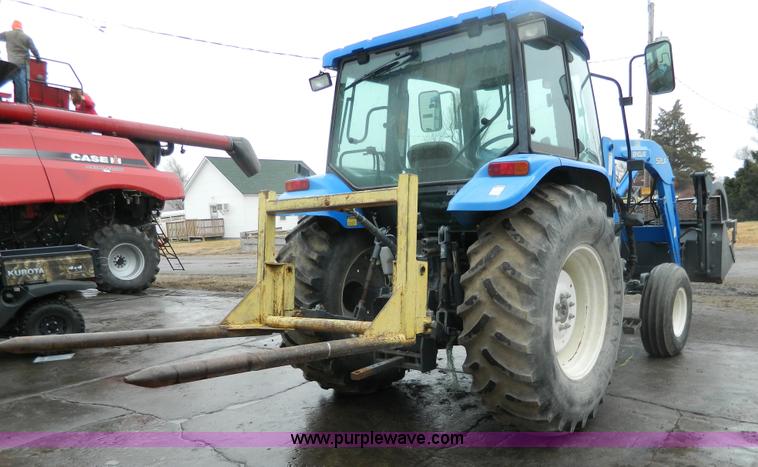 image for item H2306 2002 New Holland TL100 tractor