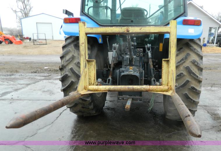 image for item H2306 2002 New Holland TL100 tractor