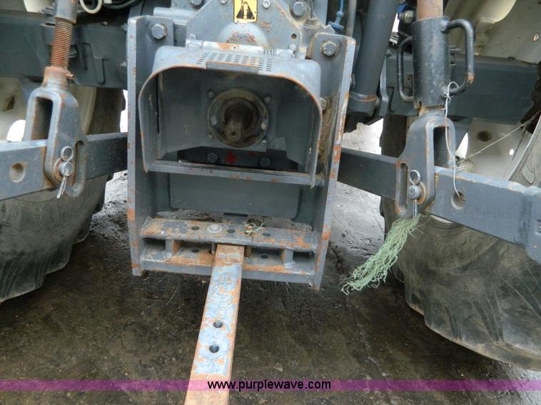 image for item H2306 2002 New Holland TL100 tractor