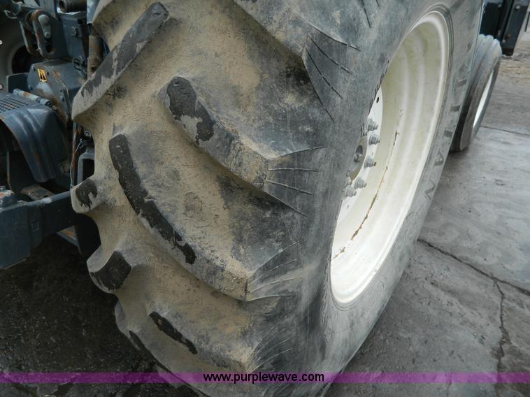 image for item H2306 2002 New Holland TL100 tractor