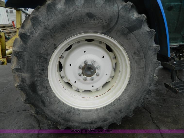 image for item H2306 2002 New Holland TL100 tractor
