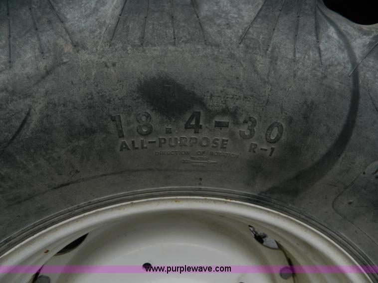 image for item H2306 2002 New Holland TL100 tractor