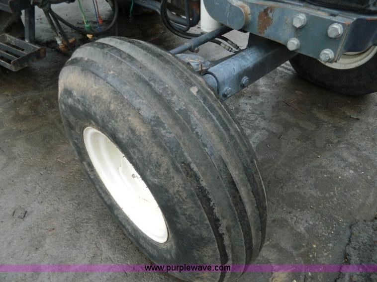 image for item H2306 2002 New Holland TL100 tractor