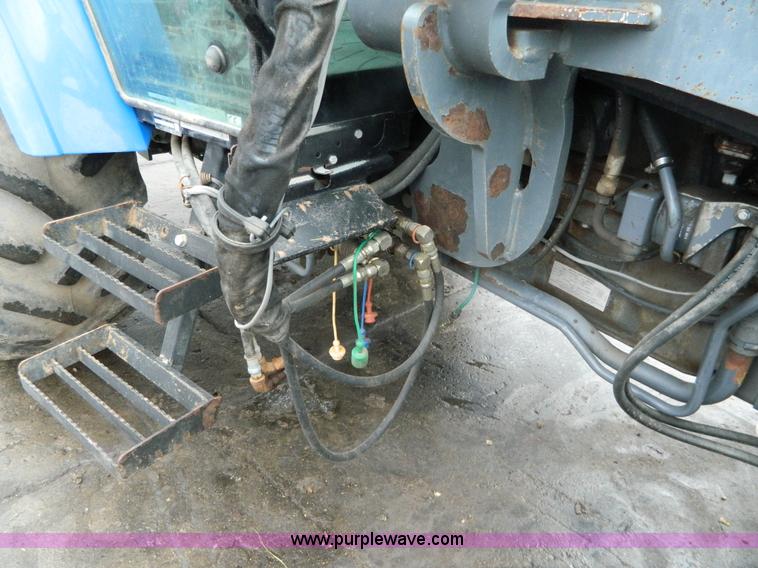 image for item H2306 2002 New Holland TL100 tractor
