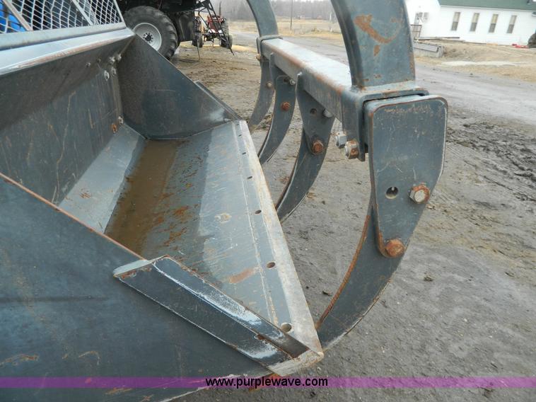 image for item H2306 2002 New Holland TL100 tractor