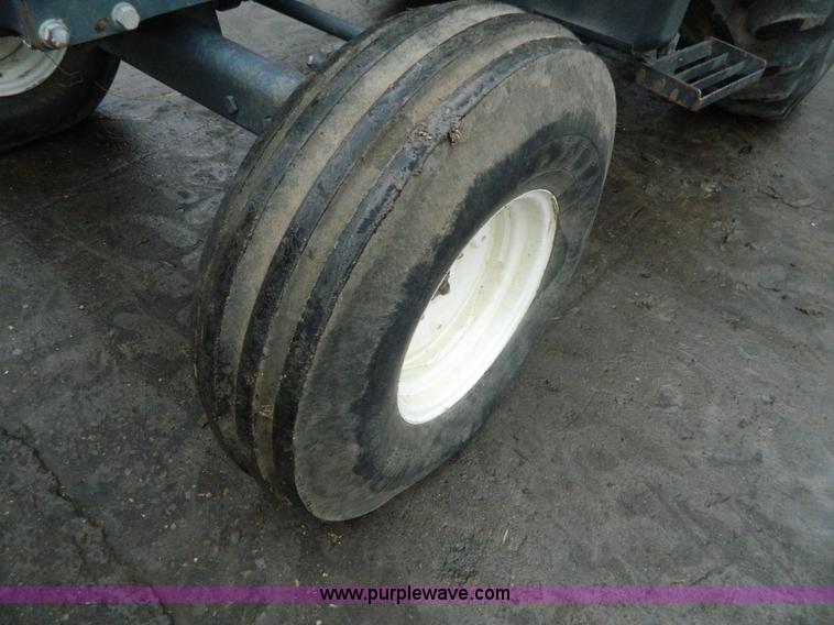 image for item H2306 2002 New Holland TL100 tractor