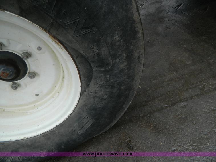 image for item H2306 2002 New Holland TL100 tractor