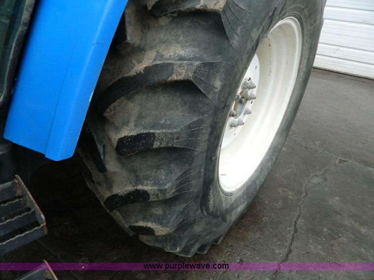 image for item H2306 2002 New Holland TL100 tractor