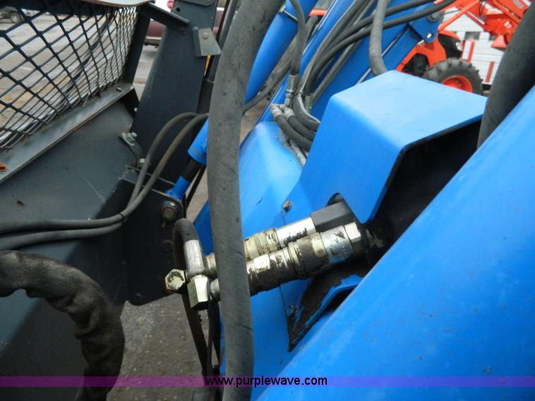 image for item H2306 2002 New Holland TL100 tractor