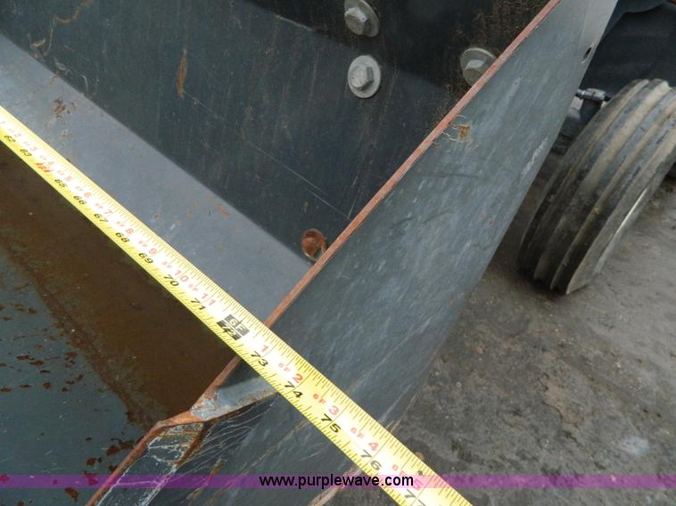 image for item H2306 2002 New Holland TL100 tractor