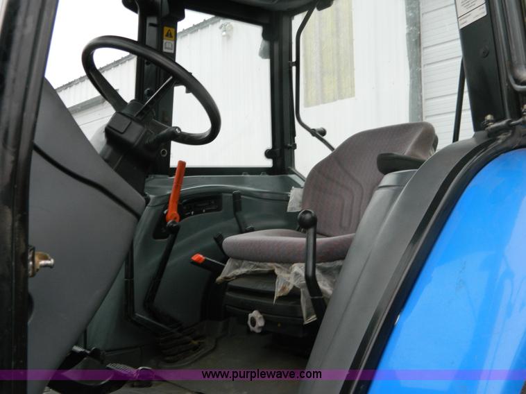 image for item H2306 2002 New Holland TL100 tractor