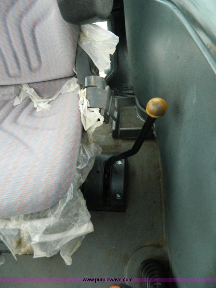 image for item H2306 2002 New Holland TL100 tractor