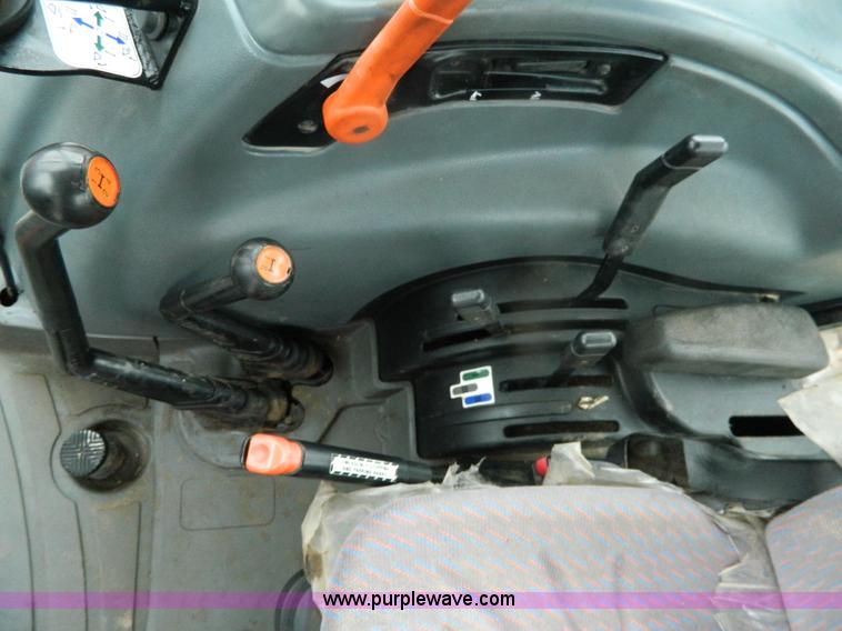 image for item H2306 2002 New Holland TL100 tractor