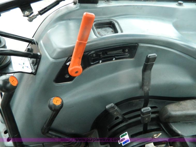 image for item H2306 2002 New Holland TL100 tractor