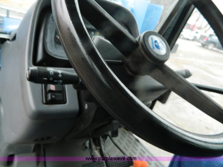 image for item H2306 2002 New Holland TL100 tractor