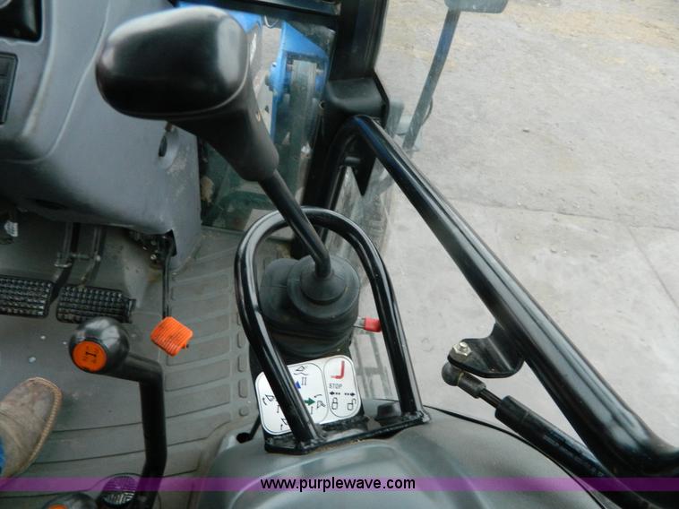 image for item H2306 2002 New Holland TL100 tractor