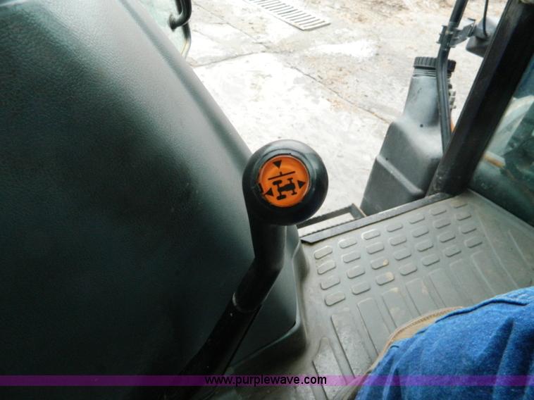 image for item H2306 2002 New Holland TL100 tractor