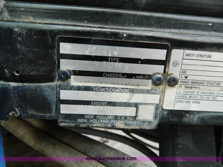 image for item H2306 2002 New Holland TL100 tractor