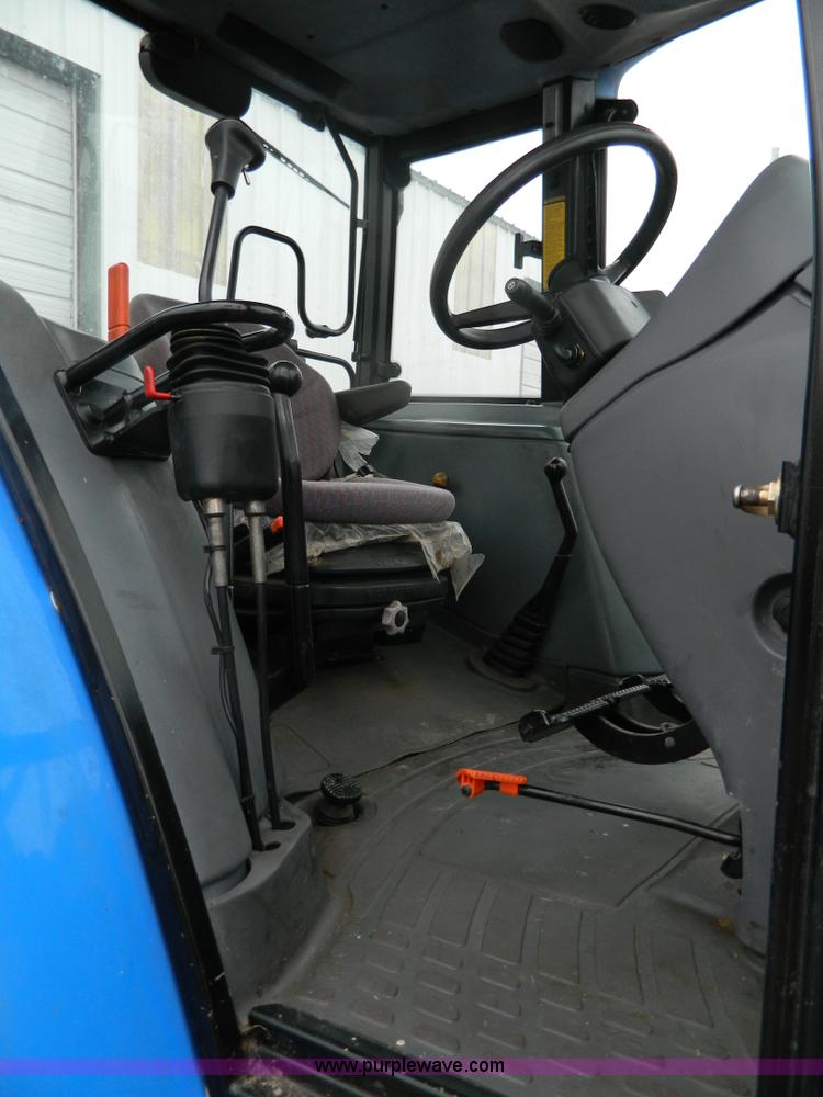 image for item H2306 2002 New Holland TL100 tractor