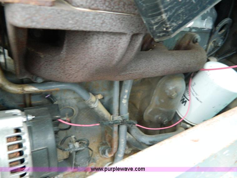 image for item H2306 2002 New Holland TL100 tractor