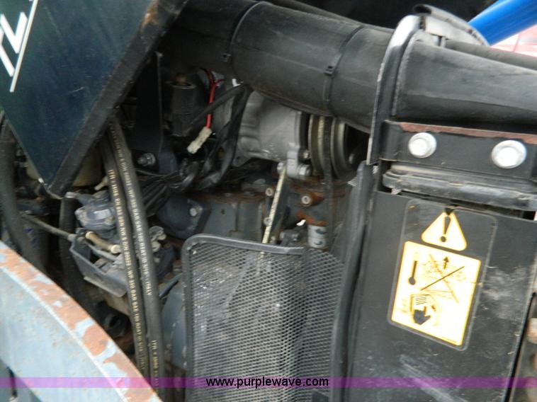 image for item H2306 2002 New Holland TL100 tractor